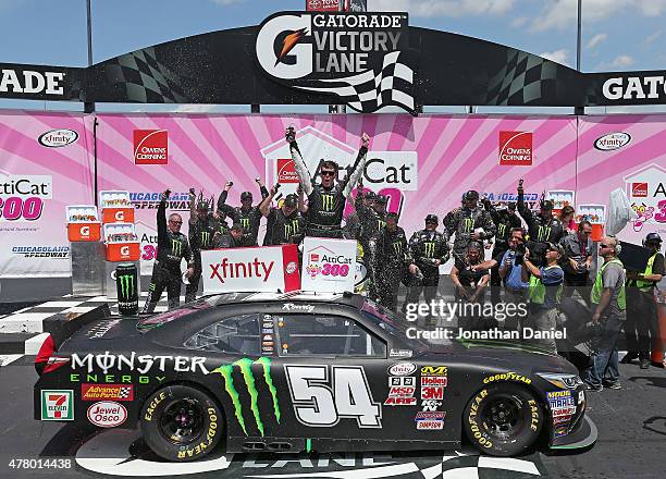 Erik Jones, driver of the Monster Energy Toyota, celebrates in victory lane after winning the NASCAR XFINITY Owens Corning AttiCat 300 at Chicagoland...