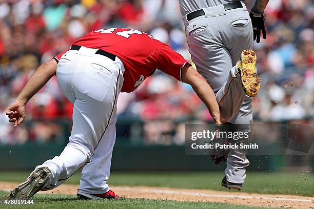 Pitcher Gio Gonzalez of the Washington Nationals tags Corey Hart of the Pittsburgh Pirates out in the fifth inning at Nationals Park on June 21, 2015...