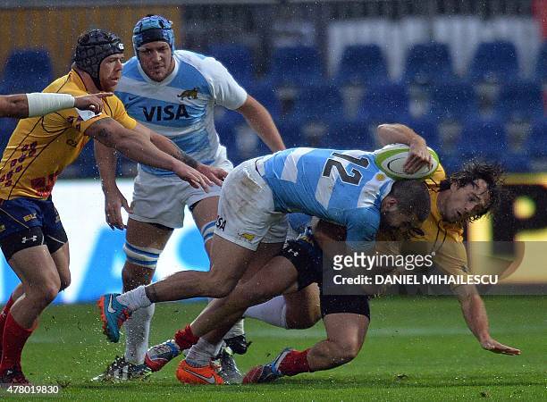 Joaquin Paz of Argentina Jaguars vies for the ball with Adrian Apostol of Romania during "World Rugby Nations Cup" in Bucharest June 21, 2015....