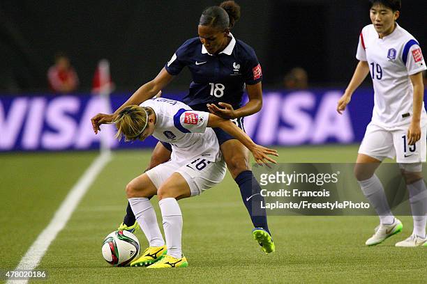 Yumi Kang of Korea controls the ball against Marie-Laure Delie of France during the FIFA Women's World Cup Canada 2015 round of 16 match between...
