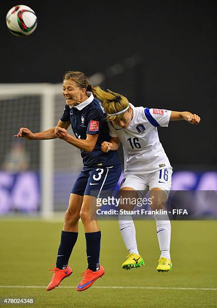 Laure Boulleau of France is challenged by Yumi Kang of Korea during the FIFA Womens's World Cup round of 16 match between France and Korea at Olympic...