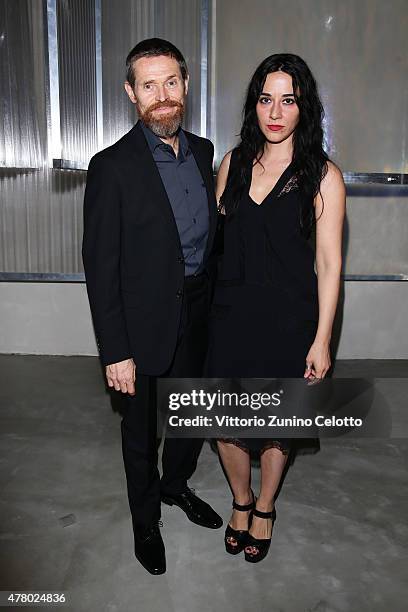 Willem Dafoe and Giada Colagrande attend the Prada show during the Milan Men's Fashion Week Spring/Summer 2016 on June 21, 2015 in Milan, Italy.