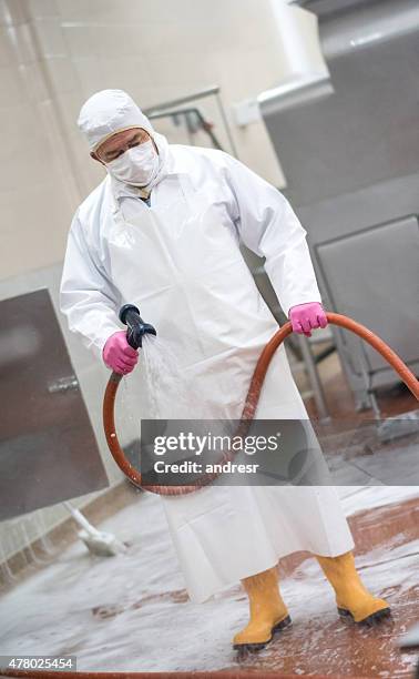 man cleaning at a factory - food processing plant clean stock pictures, royalty-free photos & images