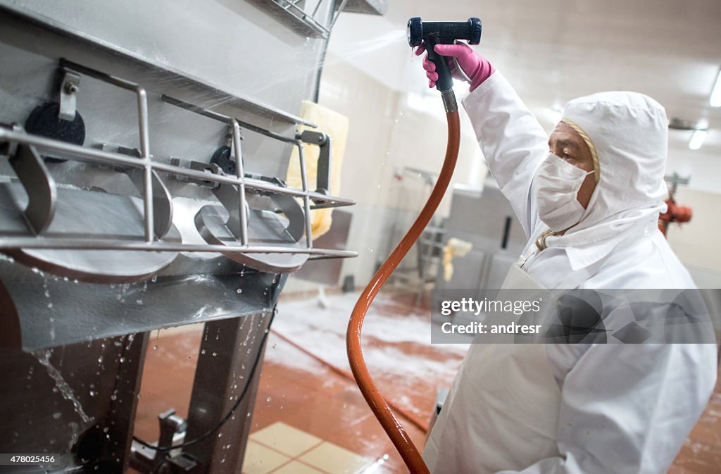 Man washing machines at a factory