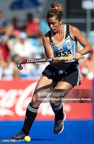 Agustina Albertario of Argentina runs with the ball during the match between Germany and Argentina at Polideportivo Virgen del Carmen during day...