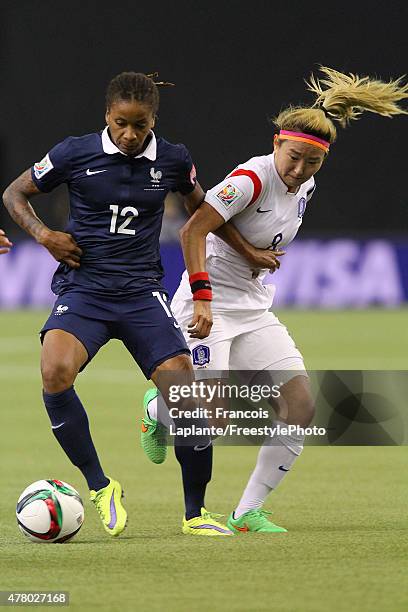 Elodie Thomis of France challenges Sohyun Cho of Korea during the FIFA Women's World Cup Canada 2015 round of 16 match between France and Korea...