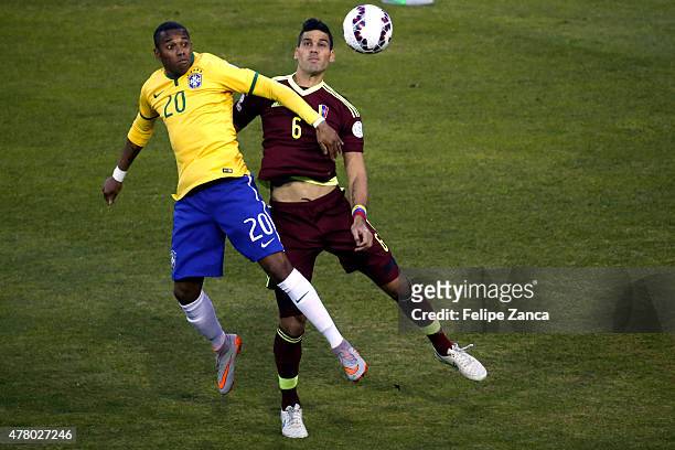 Robinho of Brazil goes for a header with Gabriel Cichero of Venezuela during the 2015 Copa America Chile Group C match between Brazil and Venezuela...