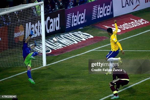 Roberto Firmino of Brazil scores the second goal of his team during the 2015 Copa America Chile Group C match between Brazil and Venezuela at...