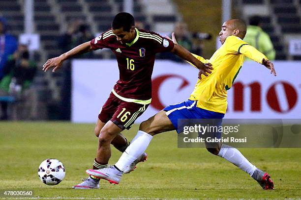 Roberto Rosales of Venezuela fights for the ball with Fernandinho of Brazil during the 2015 Copa America Chile Group C match between Brazil and...