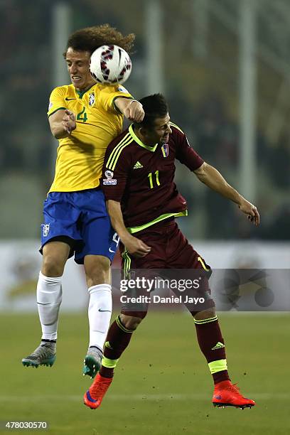 David Luiz of Brazil goes for a header with Cesar Gonzalez of Venezuela during the 2015 Copa America Chile Group C match between Brazil and Venezuela...