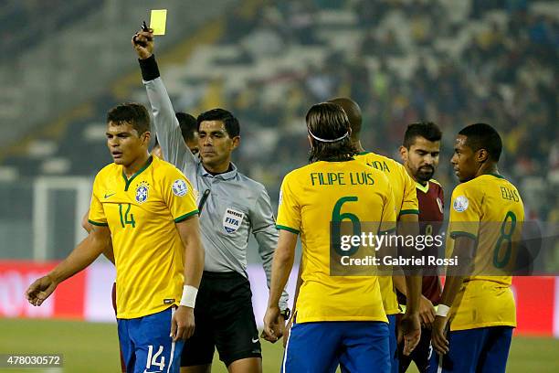 Referee Enrique Caceres shows a yellow card to Thiago Silva of Brazil during the 2015 Copa America Chile Group C match between Brazil and Venezuela...