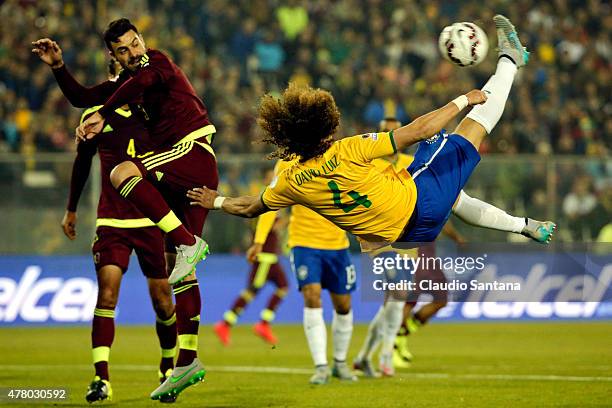 David Luiz of Brazil jumps to kick the ball during the 2015 Copa America Chile Group C match between Brazil and Venezuela at Monumental David...