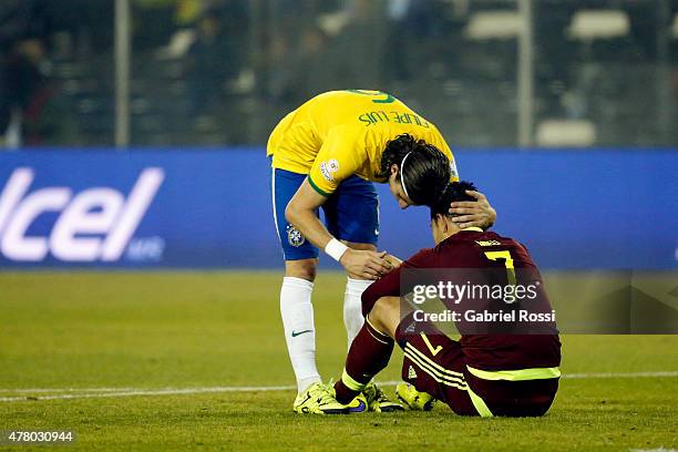 Filipe Luis of Brazil hugs Nicolas Fedor of Venezuela after the 2015 Copa America Chile Group C match between Brazil and Venezuela at Monumental...