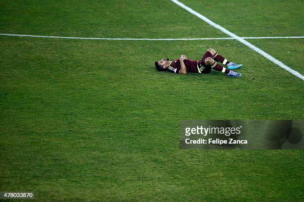 Tomas Rincon of Venezuela lies on the grass during the 2015 Copa America Chile Group C match between Brazil and Venezuela at Monumental David...
