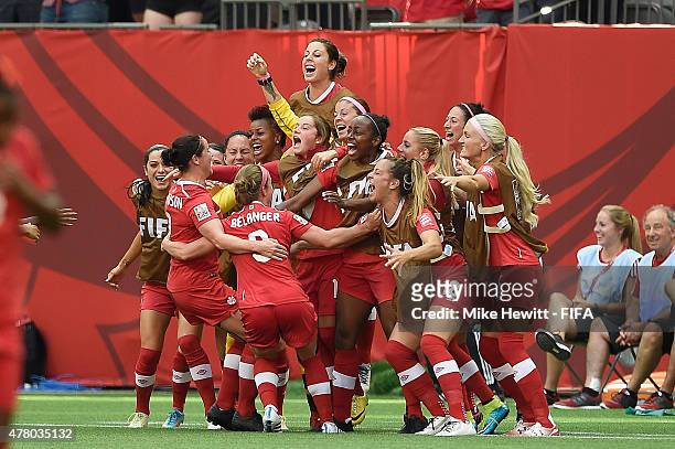 Josee Belanger of Canada celebrates with team mates after scoring during the FIFA Women's World Cup 2015 Round of 16 match between Canada and...
