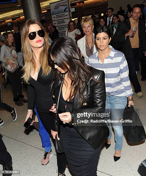 Khloe Kardashian, Kim Kardashian and Kourtney Kardashian are seen on March 11, 2014 in Miami, Florida.