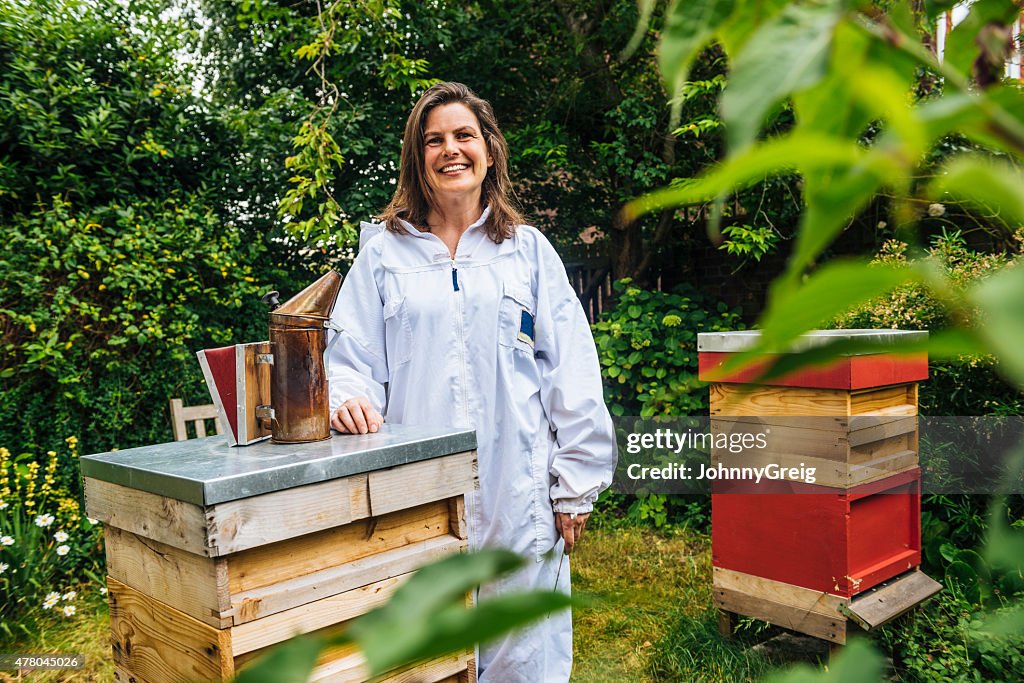 Beekeeper with her beehives