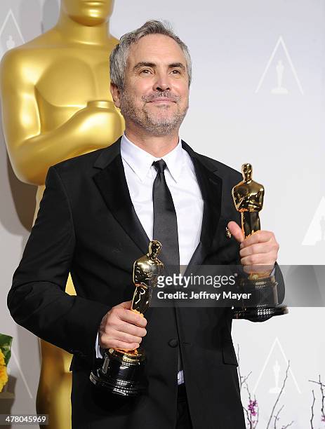 Filmmaker Alfonso Cuaron, winner of Best Achievement in Directing for 'Gravity' poses in the press room during the 86th Annual Academy Awards at...