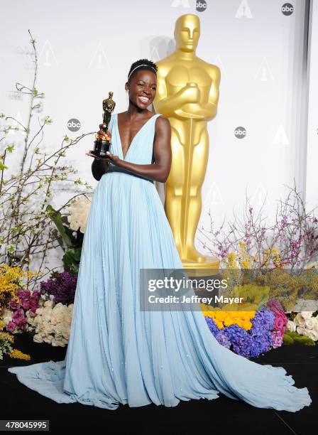 Actress Lupita Nyong'o poses in the press room during the 86th Annual Academy Awards at Loews Hollywood Hotel on March 2, 2014 in Hollywood,...