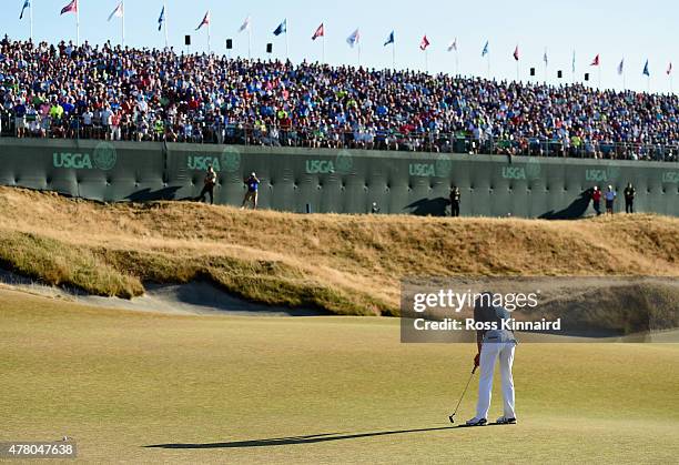 Jordan Spieth of the United States putts on the 18th green during the final round of the 115th U.S. Open Championship at Chambers Bay on June 21,...