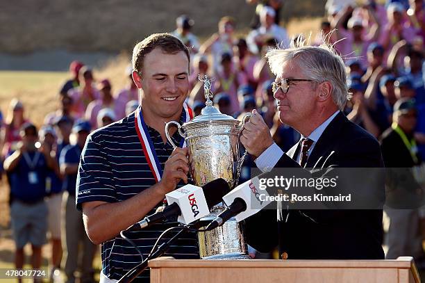 Jordan Spieth of the United States poses with the trophy alongside Thomas O'Toole, Jr., President of the USGA after Spieth won the 115th U.S. Open...