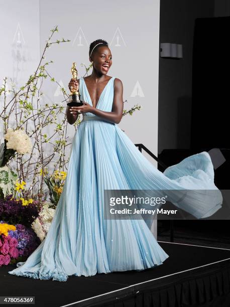 Actress Lupita Nyong'o poses in the press room during the 86th Annual Academy Awards at Loews Hollywood Hotel on March 2, 2014 in Hollywood,...