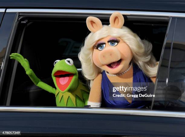 Kermit the Frog and Miss Piggy arrive at the Los Angeles premiere of "Muppets Most Wanted" at the El Capitan Theatre on March 11, 2014 in Hollywood,...