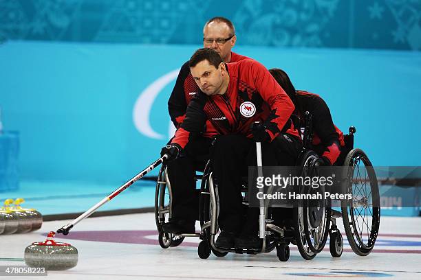 Mark Ideson of Canada competes in the wheelchair curling round robin session 9 match between Korea and Canada on day five of Sochi 2014 Paralympic...
