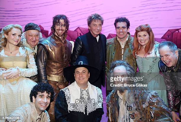 Barry Man ilow poses with the cast backstage at the hit musical "Something Rotten!" on Broadway at The St. James Theater June 21, 2015 in New York...