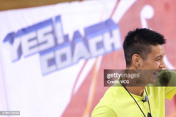 Jeremy Lin of Los Angeles Lakers plays basketball with children during Shanghai Dragon Television's show 'Yes! Coach' taping at Beijing Olympic...