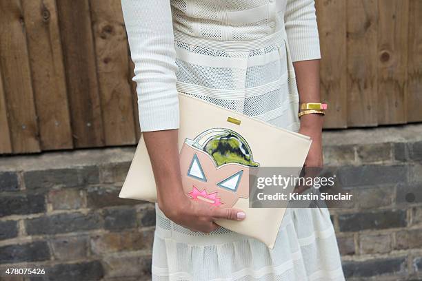 Lauren Preston of Burberry New York wears Burberry Prorsum dress, Stella McCartney purse on day 4 of London Collections: Men on June 15, 2015 in...