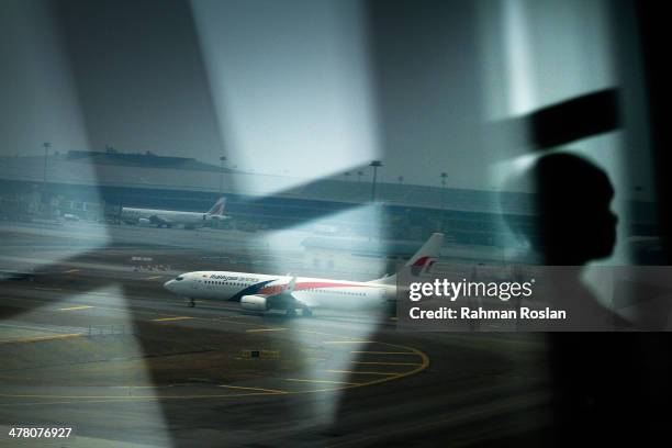 Malaysia Airlines plane is seen on the tarmac at Kuala Lumpur International Airport on March 12, 2014 in Kuala Lumpur, Malaysia. Officials have...