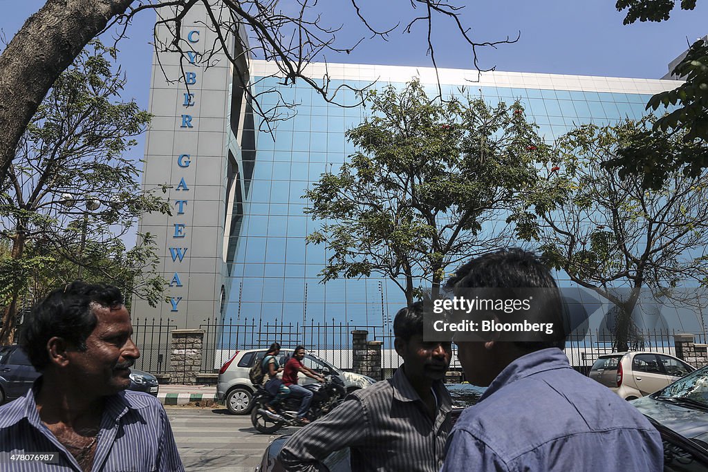 Pedestrians stand outside Cyber Gateway complex in the Hyde