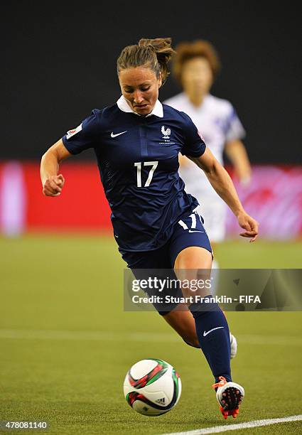 Gaetane Thiney of France is challenged by of Korea during the FIFA Womens's World Cup round of 16 match between France and Korea at Olympic Stadium...