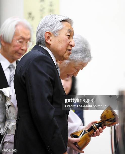 Emperor Akihito and Empress Michiko watch the artworks of the award winnders prior to the Japan Art Academy award ceremony at the Japan Art Academy...