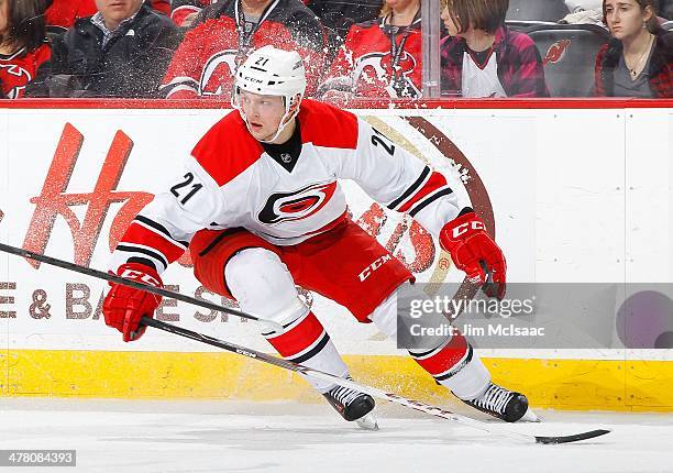 Drayson Bowman of the Carolina Hurricanes in action against the New Jersey Devils at the Prudential Center on March 8, 2014 in Newark, New Jersey....
