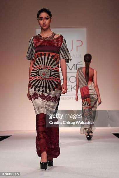 Model walks the runway wearing designs by Sougat Paul at day 2 of Lakme Fashion Week Summer/Resort 2014 at the Grand Hyatt on March 12, 2014 in...