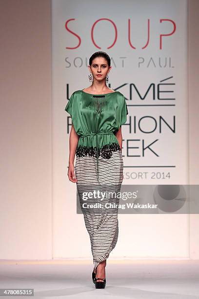 Model walks the runway wearing designs by Sougat Paul at day 2 of Lakme Fashion Week Summer/Resort 2014 at the Grand Hyatt on March 12, 2014 in...