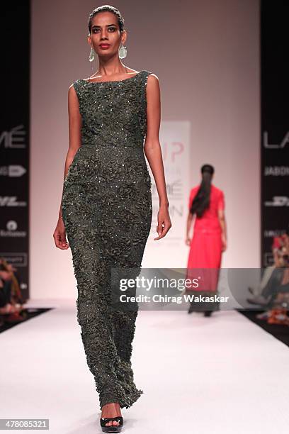 Model walks the runway wearing designs by Sougat Paul at day 2 of Lakme Fashion Week Summer/Resort 2014 at the Grand Hyatt on March 12, 2014 in...