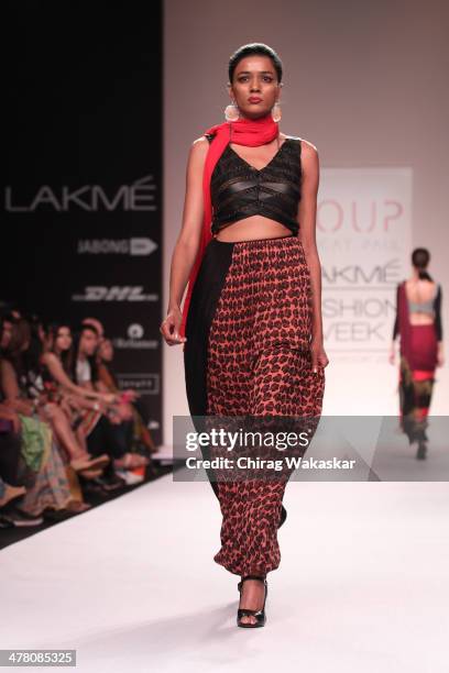 Model walks the runway wearing designs by Sougat Paul at day 2 of Lakme Fashion Week Summer/Resort 2014 at the Grand Hyatt on March 12, 2014 in...