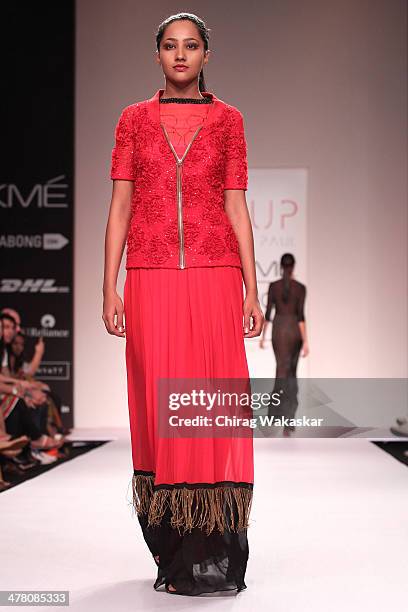 Model walks the runway wearing designs by Sougat Paul at day 2 of Lakme Fashion Week Summer/Resort 2014 at the Grand Hyatt on March 12, 2014 in...