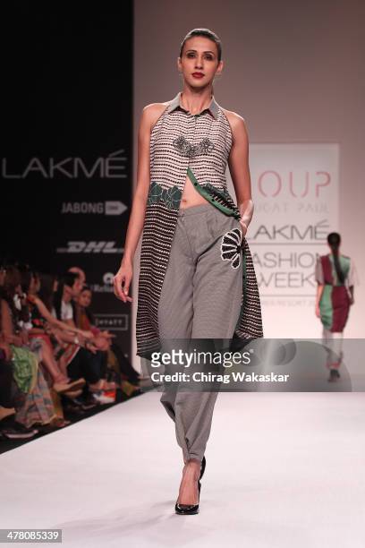 Model walks the runway wearing designs by Sougat Paul at day 2 of Lakme Fashion Week Summer/Resort 2014 at the Grand Hyatt on March 12, 2014 in...