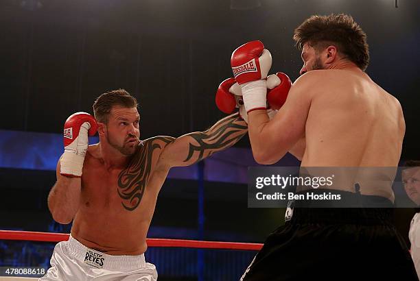 Lee Nutland of England and Paul Morris of England exchange blows during their Cruiserweight bout at Action Indoor Sports Arena on June 13, 2015 in...