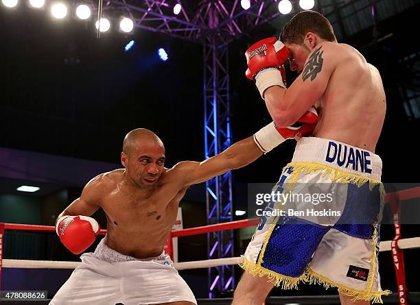 Ryan Wheeler of England and Janis Puksins of Latvia exchange blows during their Super Featherweight bout at Action Indoor Sports Arena on June 13,...