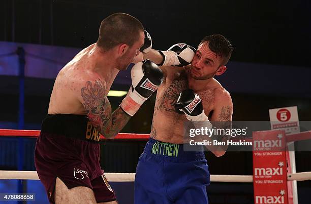Josh Baker of England and Matthew Ashmole of England exchange blows during their Super Welterweight bout at Action Indoor Sports Arena on June 13,...