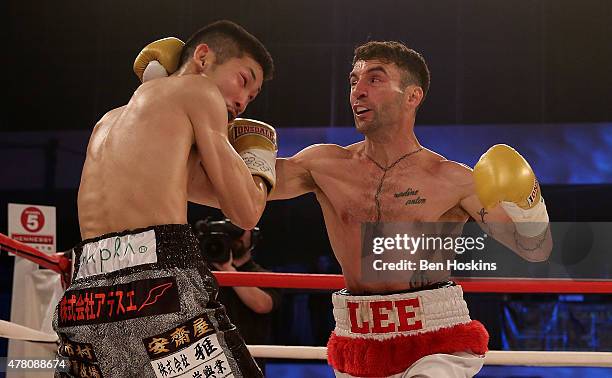 Lee Haskins of Great Britain and Ryosuke Iwasa of Japan exchange blows during their Interim IBF World Bantamweight Title Fight at Action Indoor...