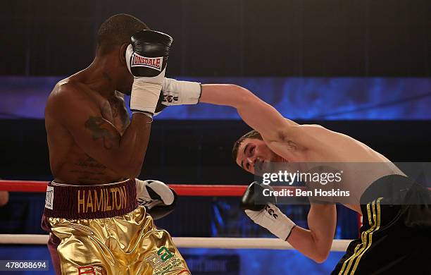 Darren Hamilton of Great Britain and Mikheil Avakyan of Georgia exchange blows during their Super Lightweight bout at Action Indoor Sports Arena on...
