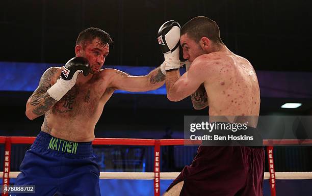 Josh Baker of England and Matthew Ashmole of England exchange blows during their Super Welterweight bout at Action Indoor Sports Arena on June 13,...