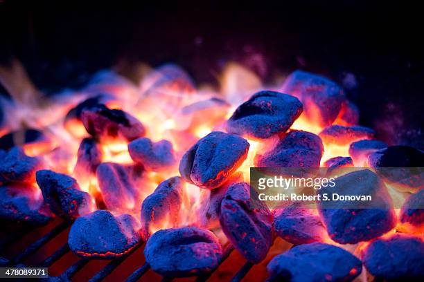 fire + ice - briquette stock pictures, royalty-free photos & images