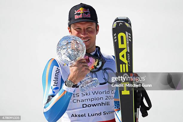 Aksel Lund Svindal of Norway poses with the crystal globe after winning the overall downhill title at the Audi FIS Alpine Skiing World Cup Finals...